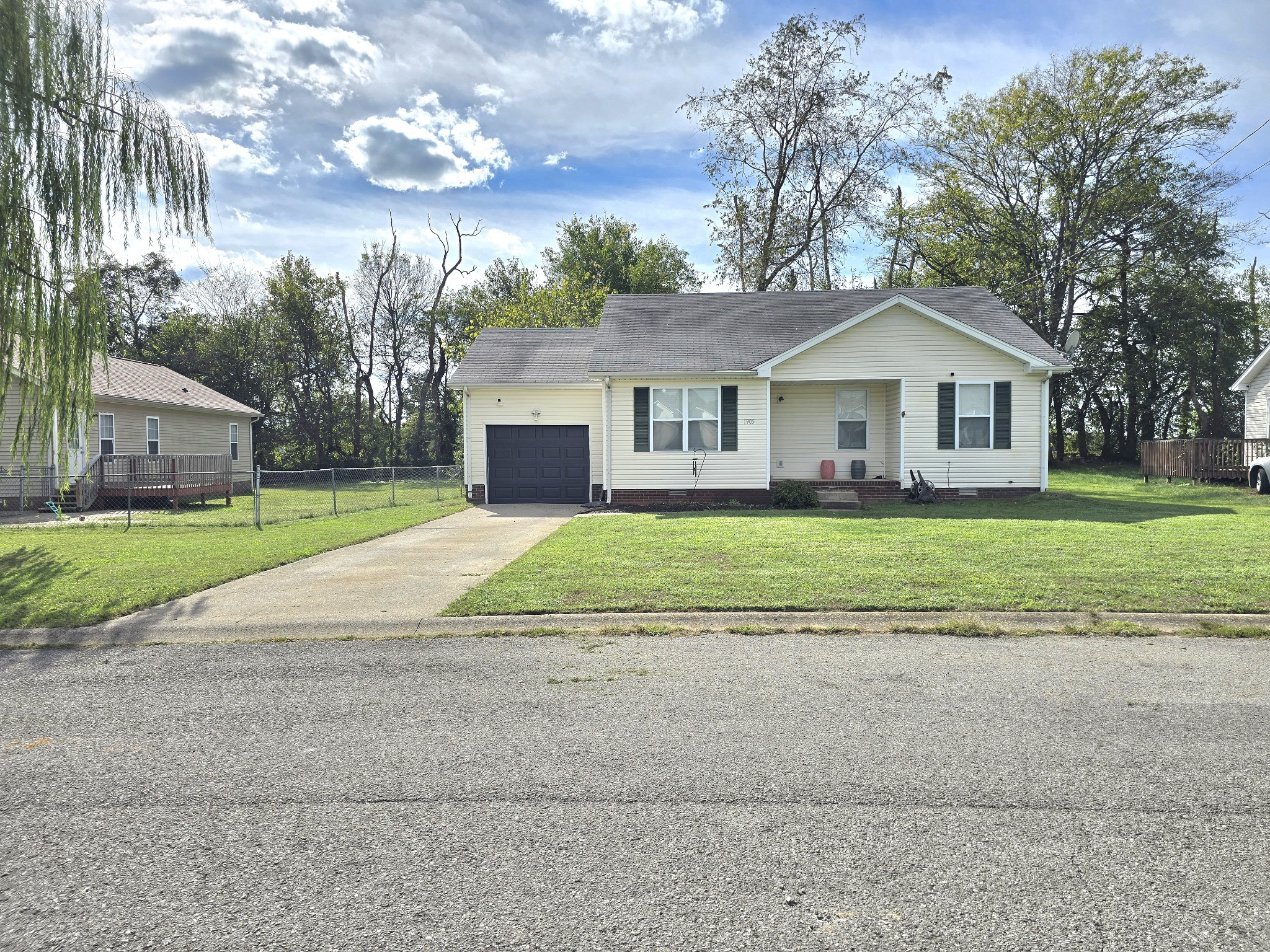1905 Timberline Circle Oak Grove, KY 42262 - Photo 1 of 33 a view of a house with a big yard and large trees