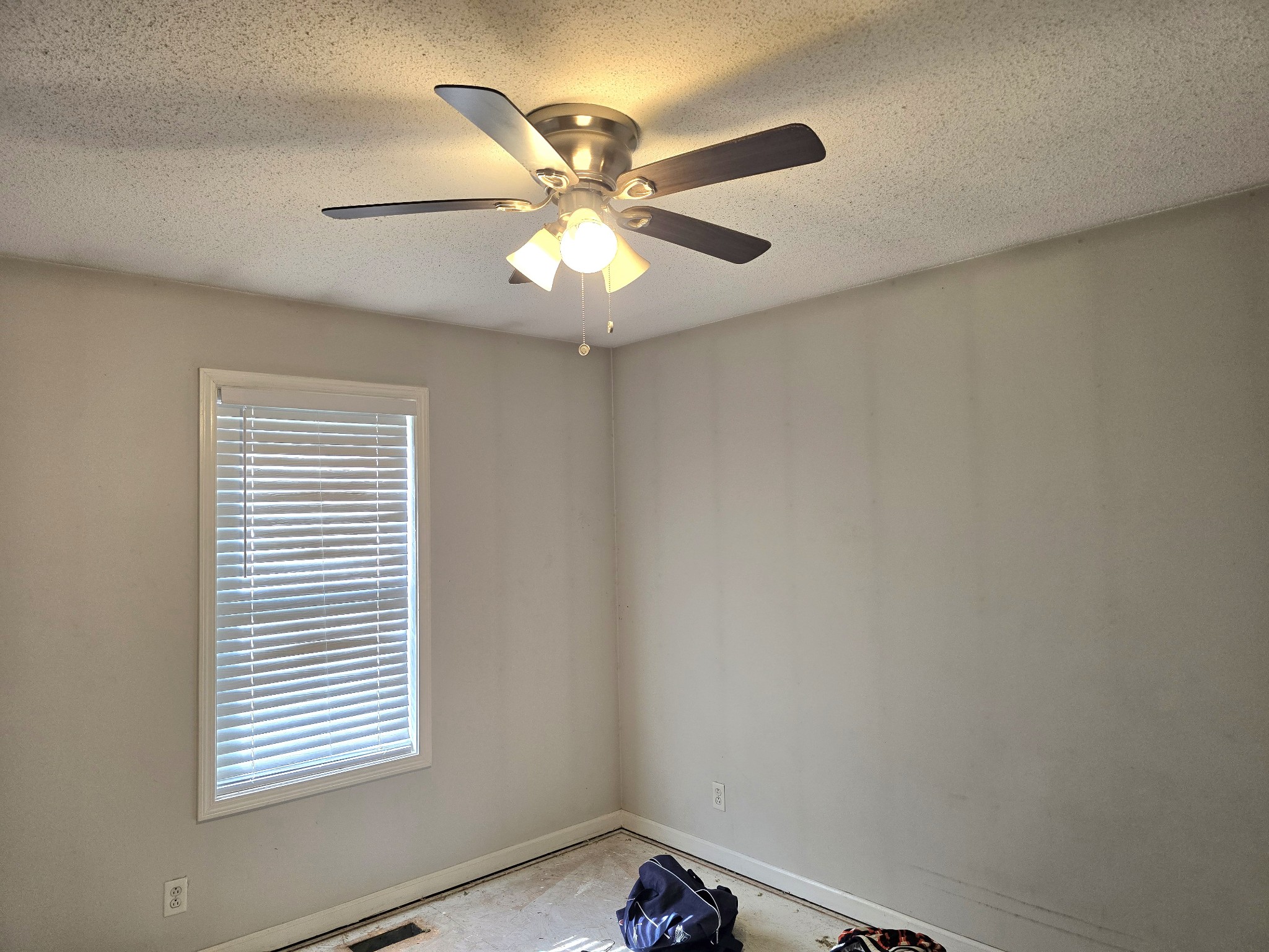 1905 Timberline Circle Oak Grove, KY 42262 - Photo 17 of 33 an empty room with windows and fan