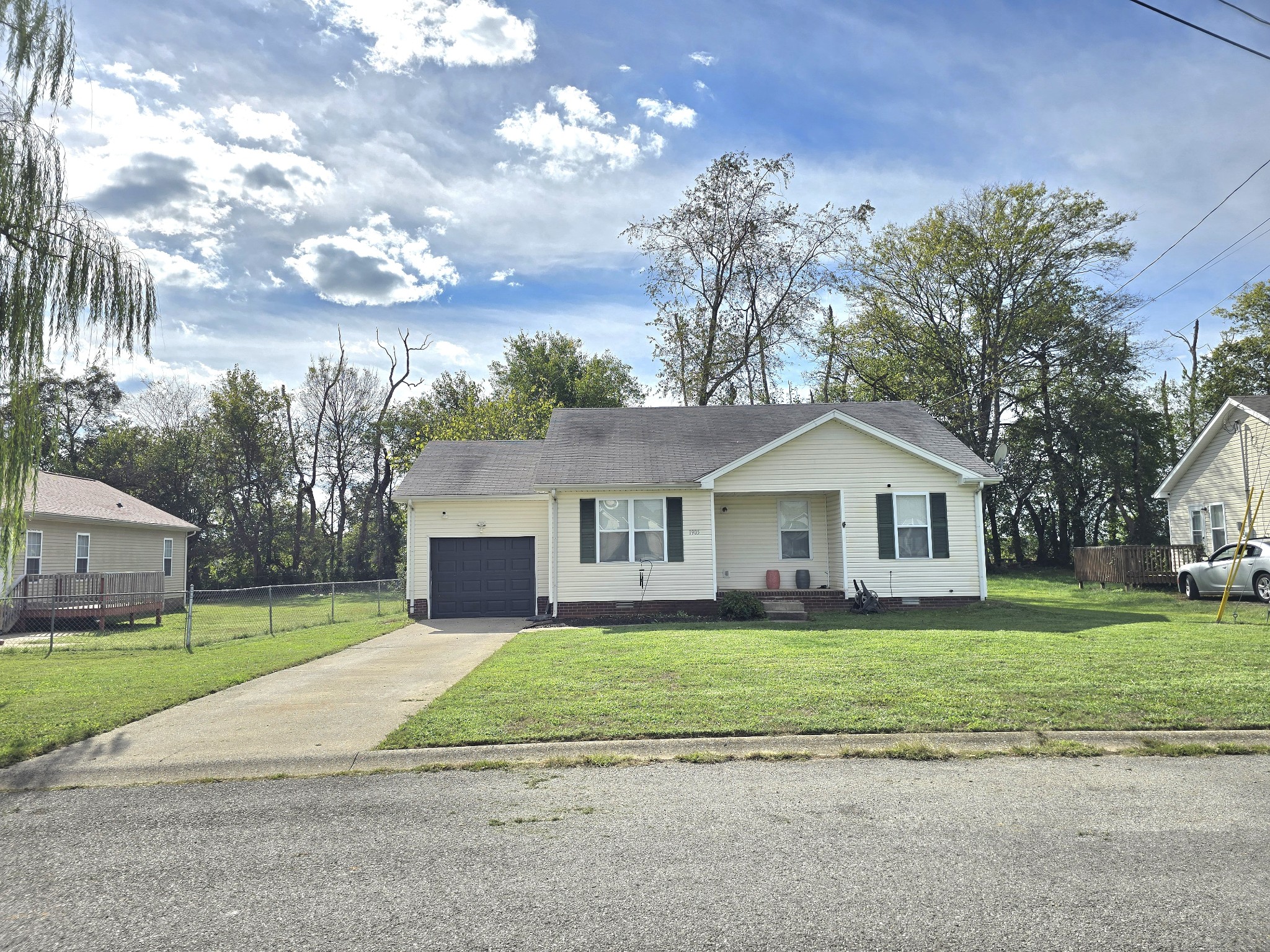 1905 Timberline Circle Oak Grove, KY 42262 - Photo 4 of 33 a front view of a house with a garden and trees