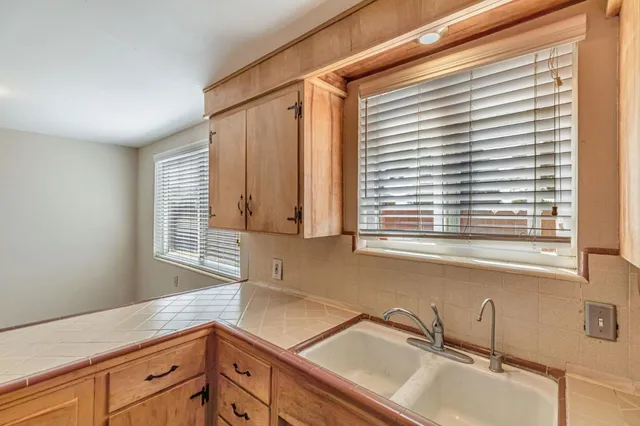 aerial view of a house with outdoor space and lake view