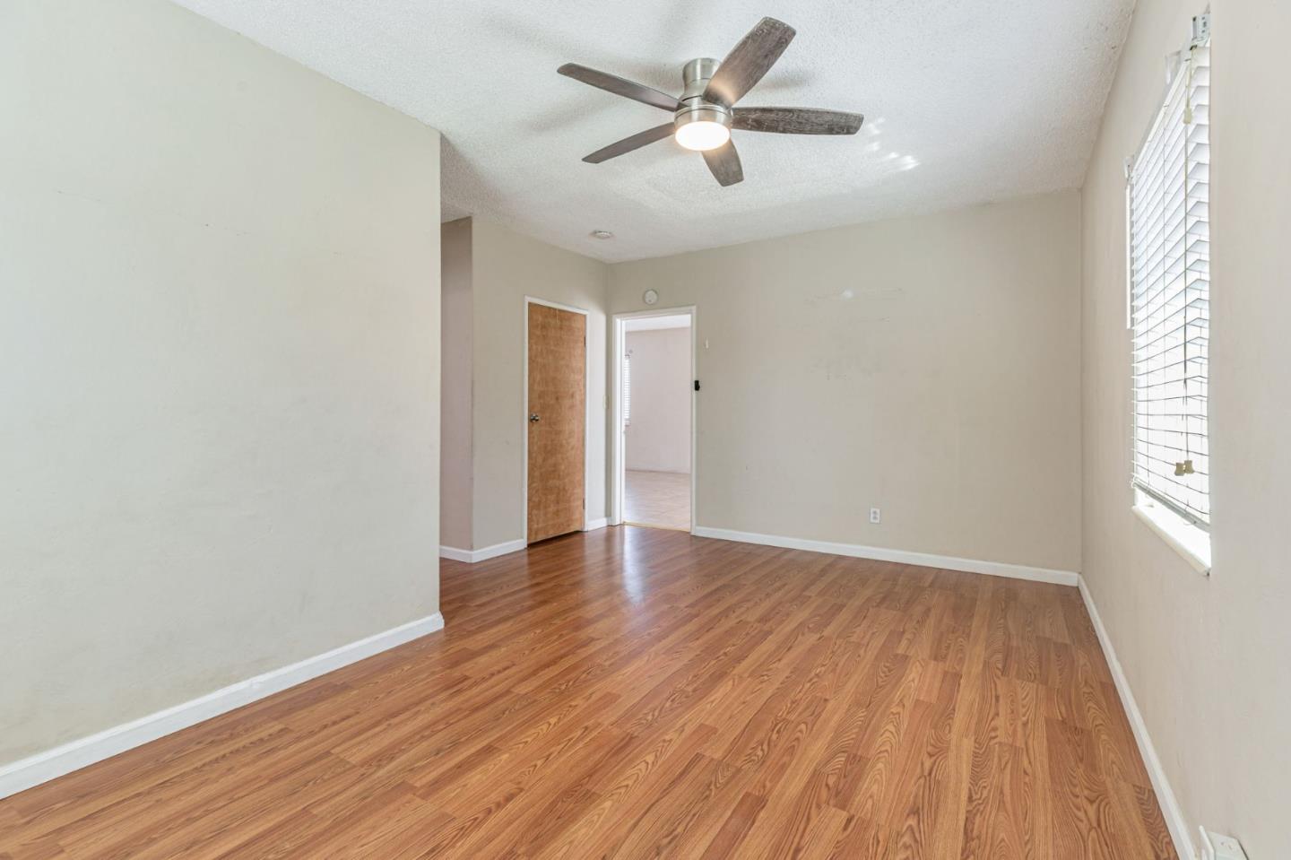 2718 Ferguson Road Gilroy, CA 95020 - Photo 37 of 94 an empty room with wooden floor and windows