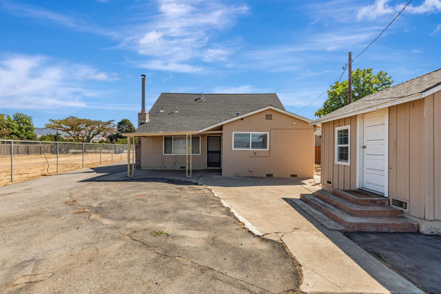 2718 Ferguson Road Gilroy, CA 95020 - Photo 51 of 94 a front view of a house with a yard and potted plants