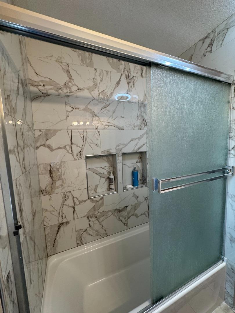 2718 Ferguson Road Gilroy, CA 95020 - Photo 70 of 94 a bathroom with a bathtub and shower