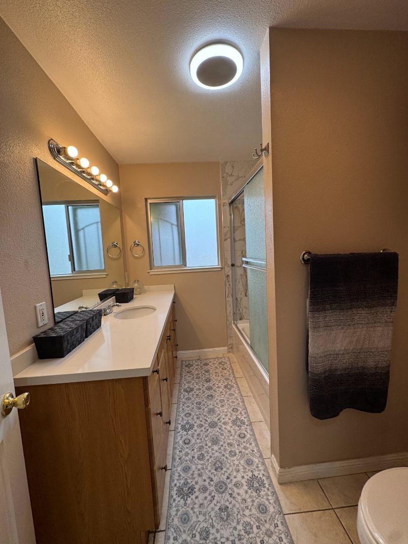 2718 Ferguson Road Gilroy, CA 95020 - Photo 72 of 94 a bathroom with a sink and a mirror