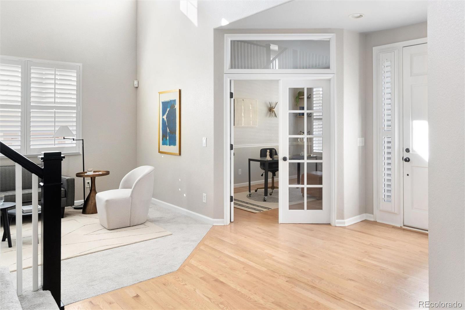 2836 Rockbridge Circle Highlands Ranch, CO 80129 - Photo 14 of 50 a view of a livingroom with a furniture and front door