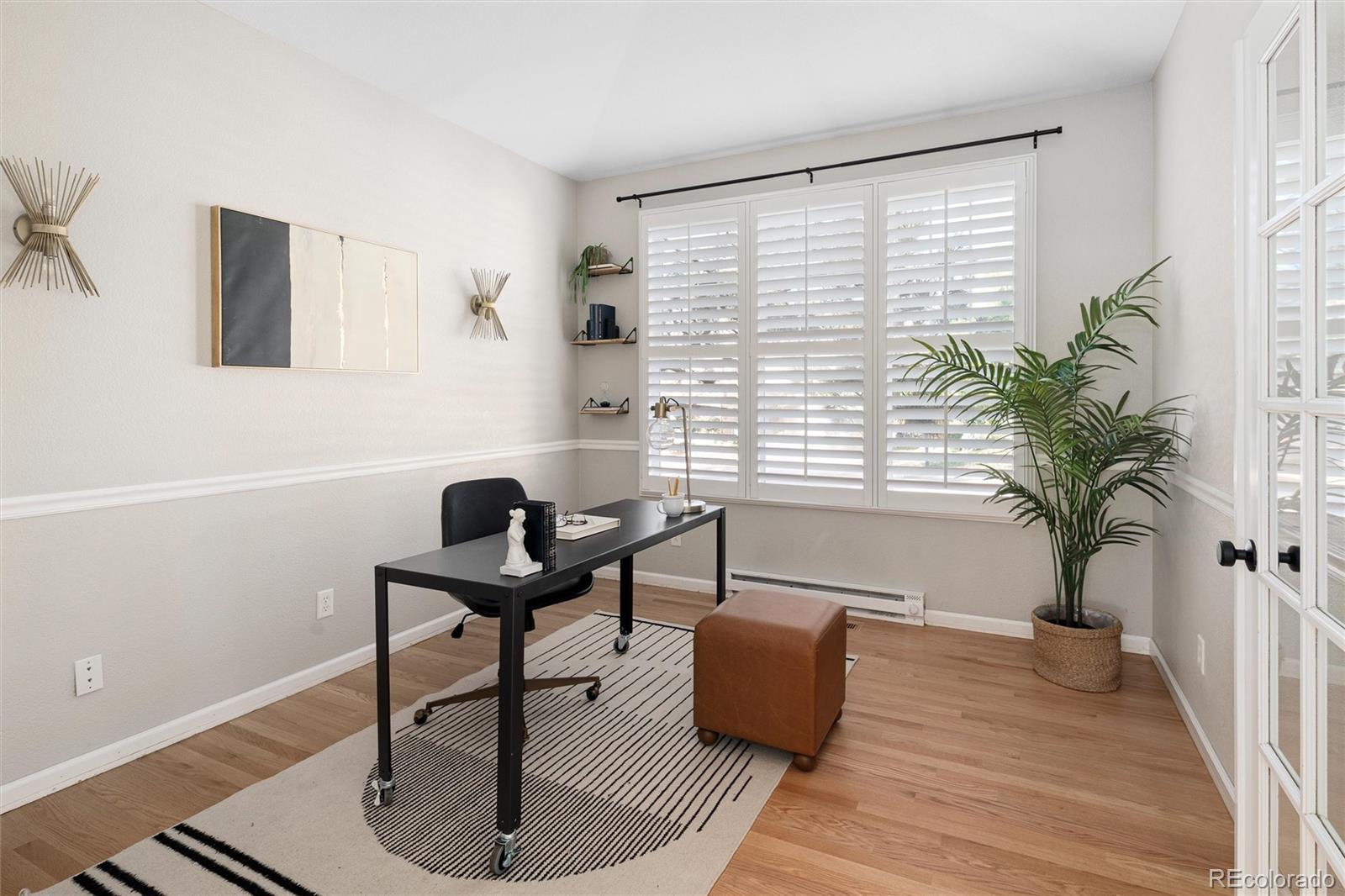 2836 Rockbridge Circle Highlands Ranch, CO 80129 - Photo 16 of 50 a work room with furniture and a potted plant