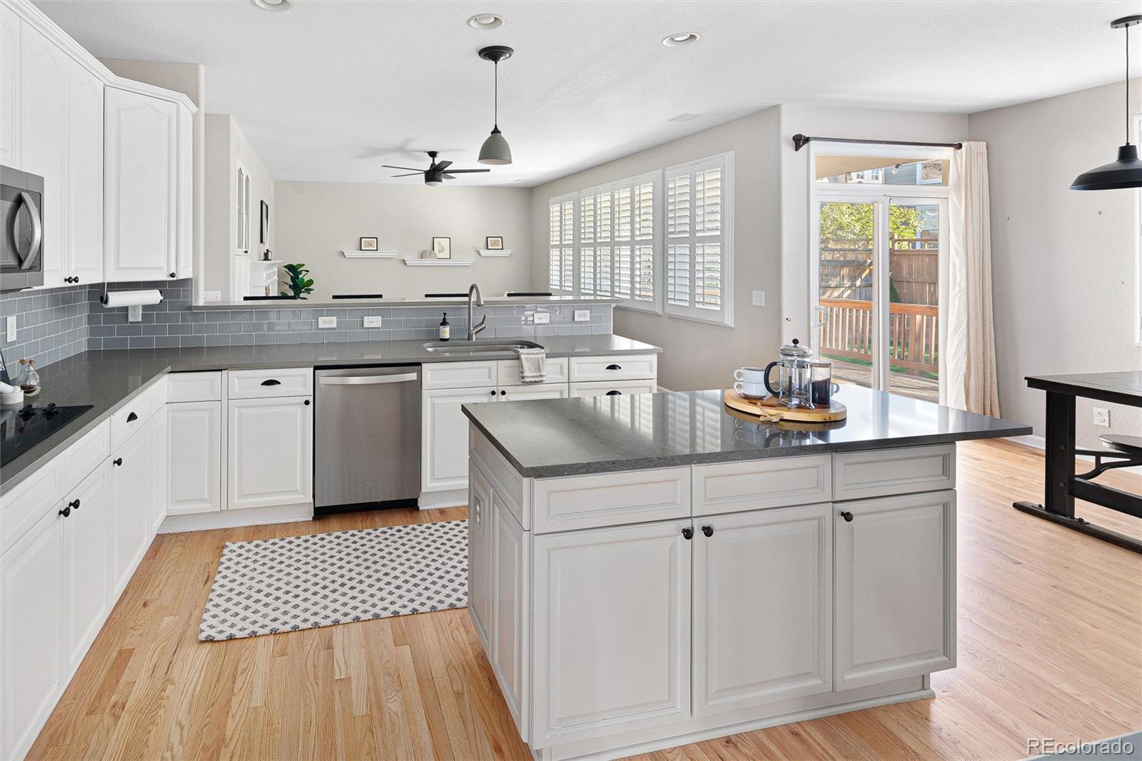 2836 Rockbridge Circle Highlands Ranch, CO 80129 - Photo 23 of 50 a kitchen with a sink window and cabinets