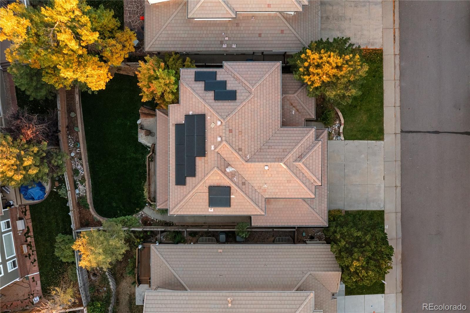 2836 Rockbridge Circle Highlands Ranch, CO 80129 - Photo 3 of 50 an aerial view of a house with a yard and large trees