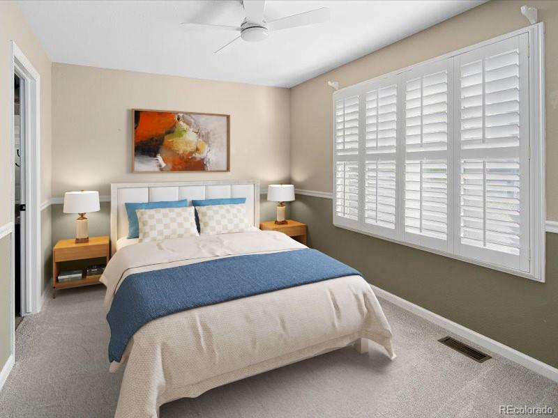 2836 Rockbridge Circle Highlands Ranch, CO 80129 - Photo 37 of 50 a bedroom with a bed and window