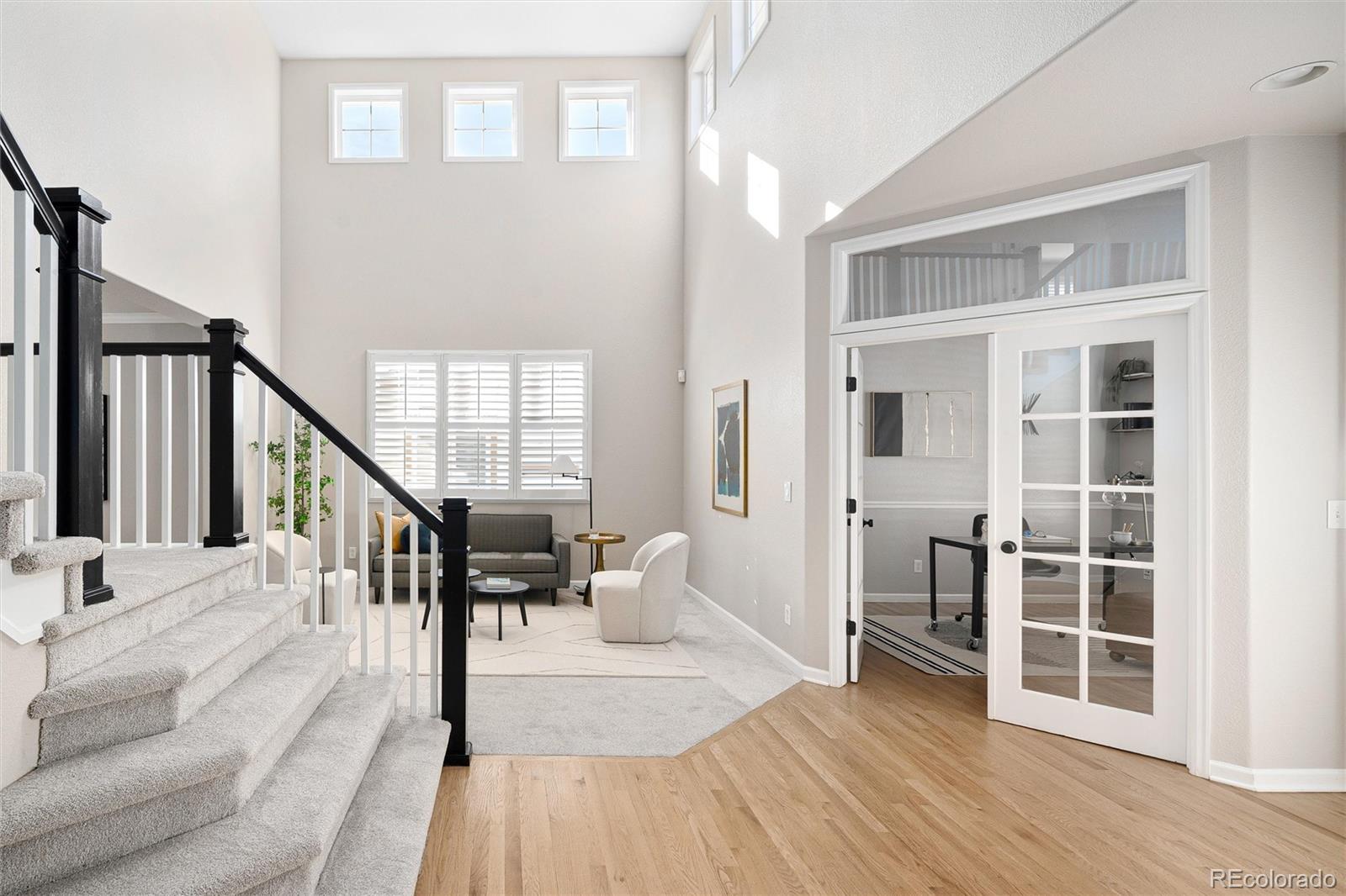 2836 Rockbridge Circle Highlands Ranch, CO 80129 - Photo 8 of 50 a dining room with wooden floor and windows