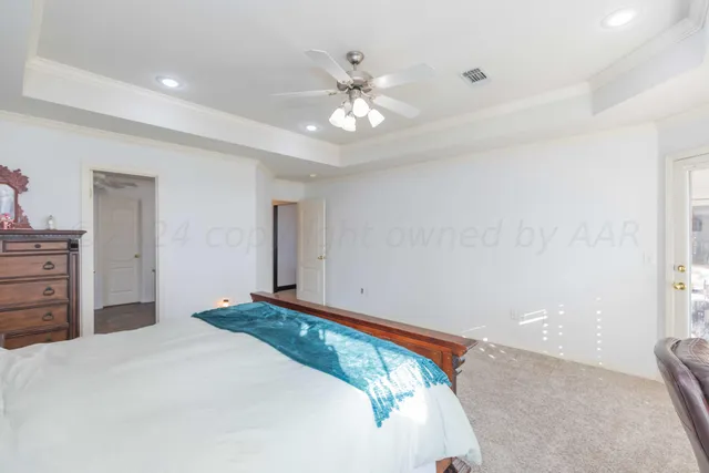 a spacious bathroom with a double vanity sink a large mirror and a shower