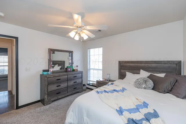 a bathroom with a sink vanity granite and a mirror