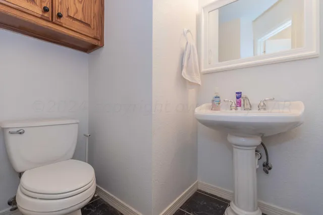 a view of a storage and utility room with washer and dryer