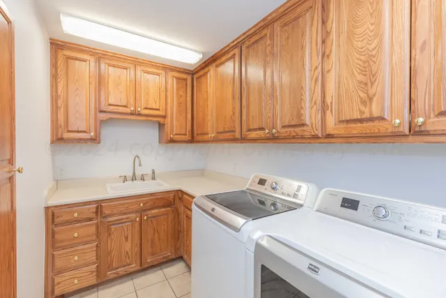 a view of backyard with wooden fence