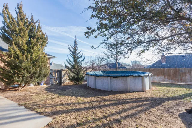 a view of a patio with a table and chairs