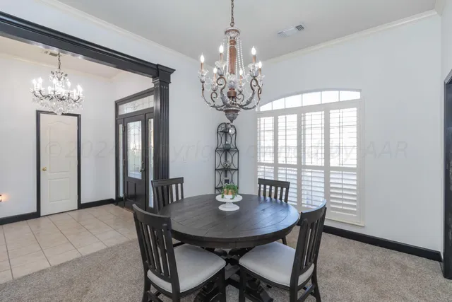 a living room with furniture and a ceiling fan