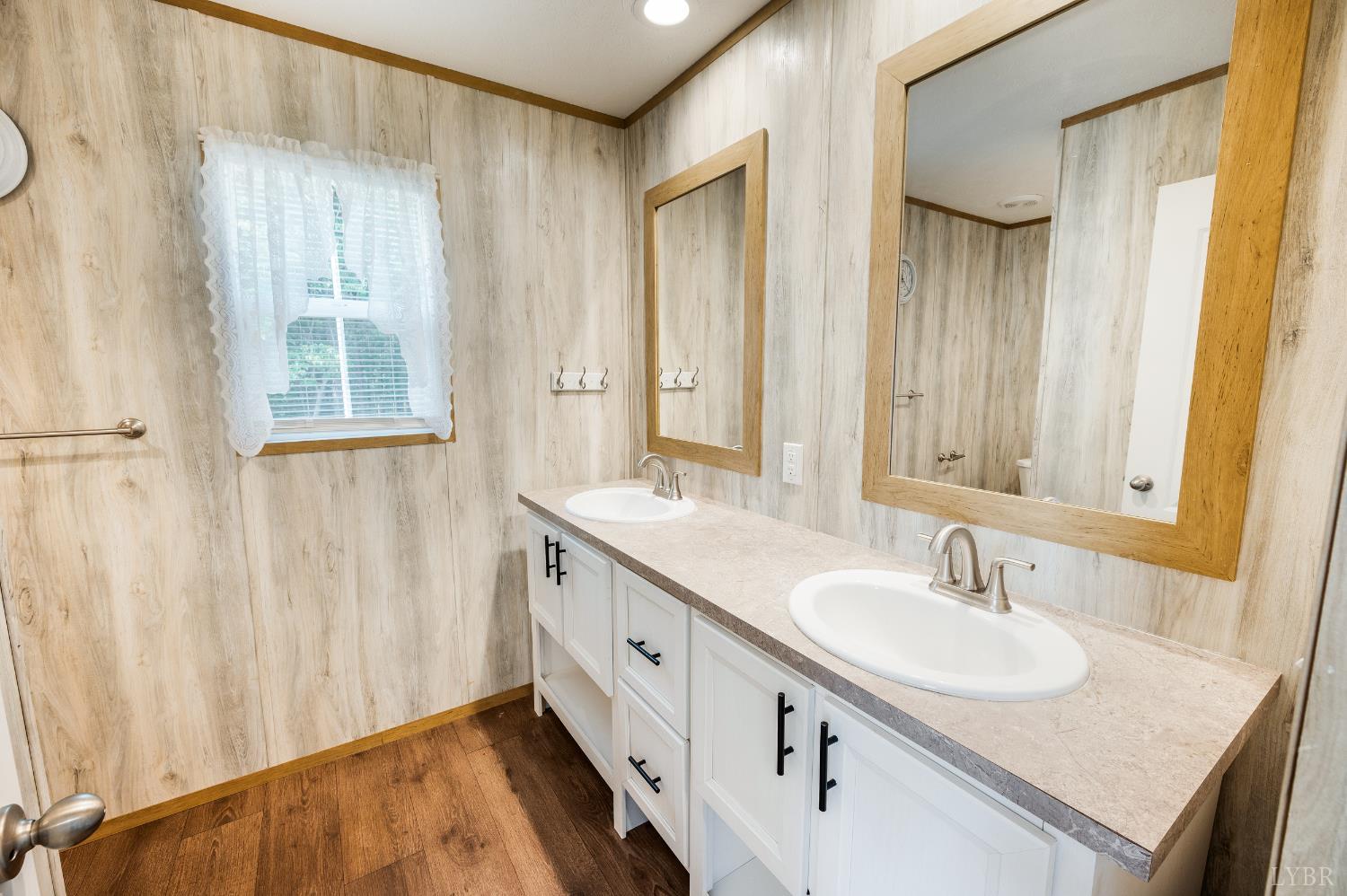 4560 Tye River Road Amherst, VA 24521 - Photo 15 of 40 a bathroom with 2 sink and a mirror