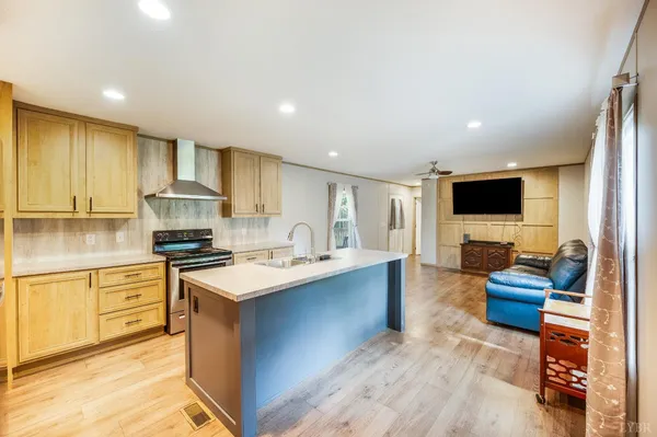 a kitchen with stainless steel appliances granite countertop a stove and a refrigerator