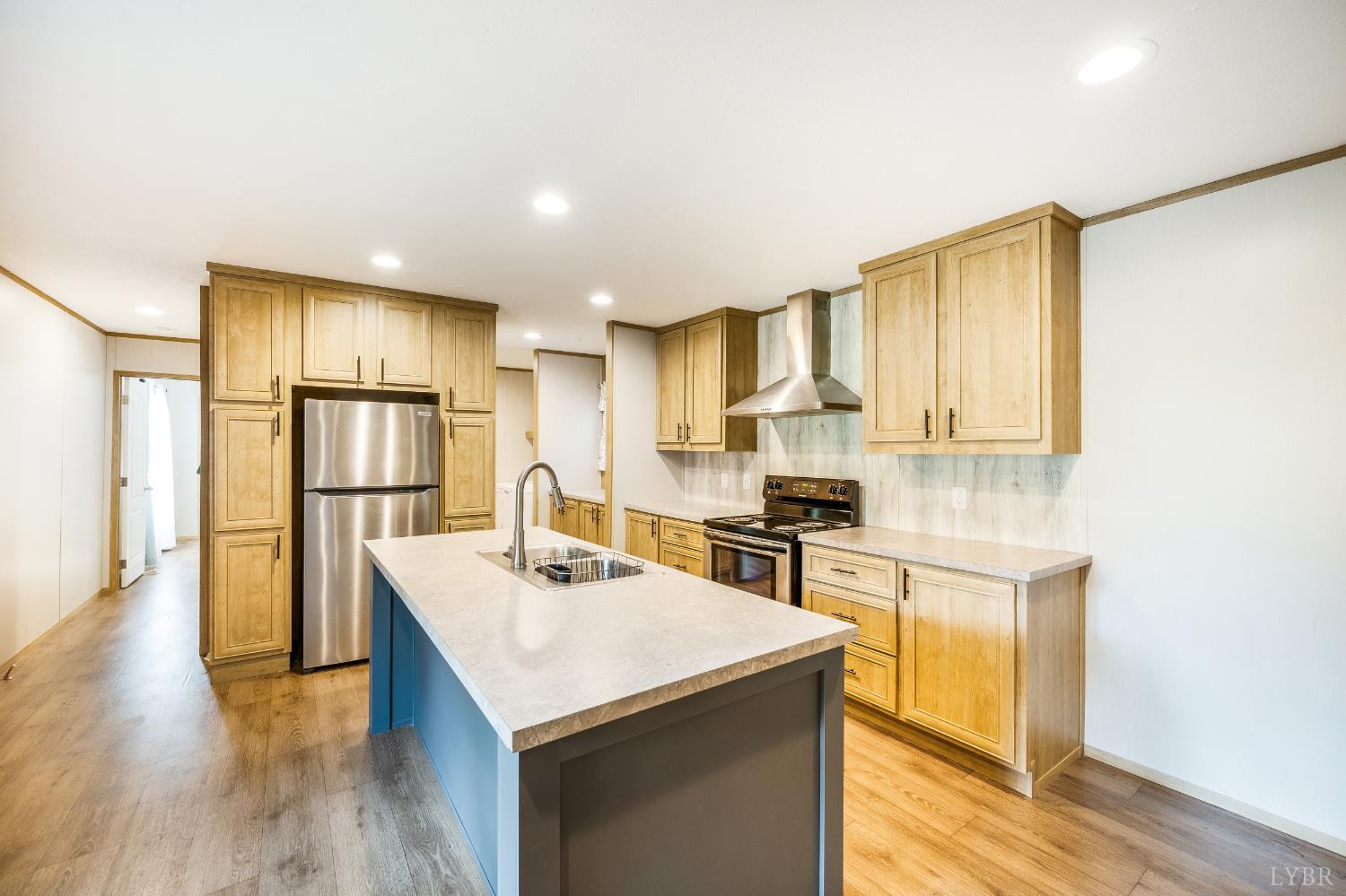 4560 Tye River Road Amherst, VA 24521 - Photo 5 of 40 a kitchen with a sink a stove a refrigerator a center island and a window