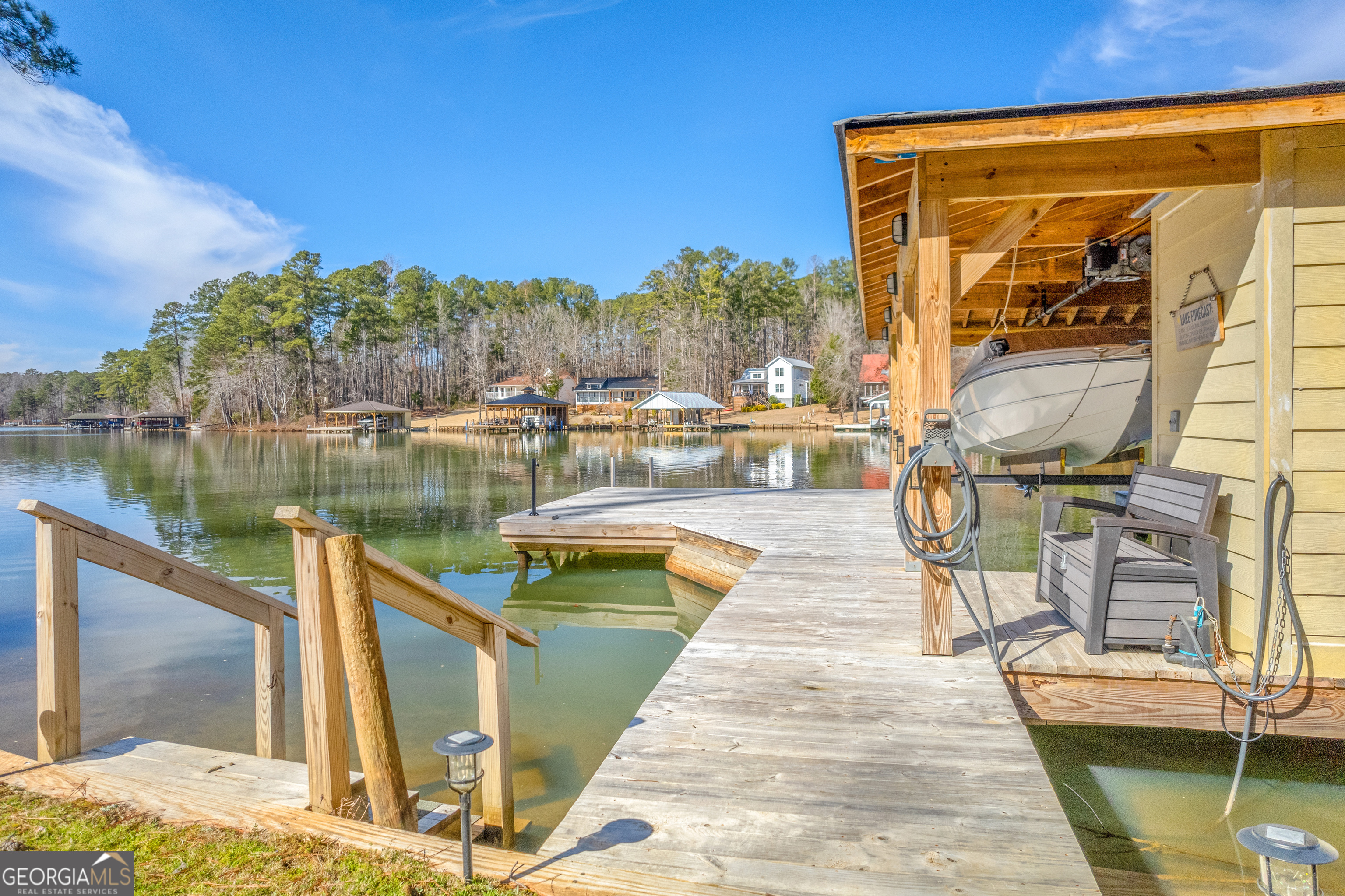 188 Sunhaven Lane Sparta, GA 31087 - Photo 12 of 63 a view of a lake with couches chairs