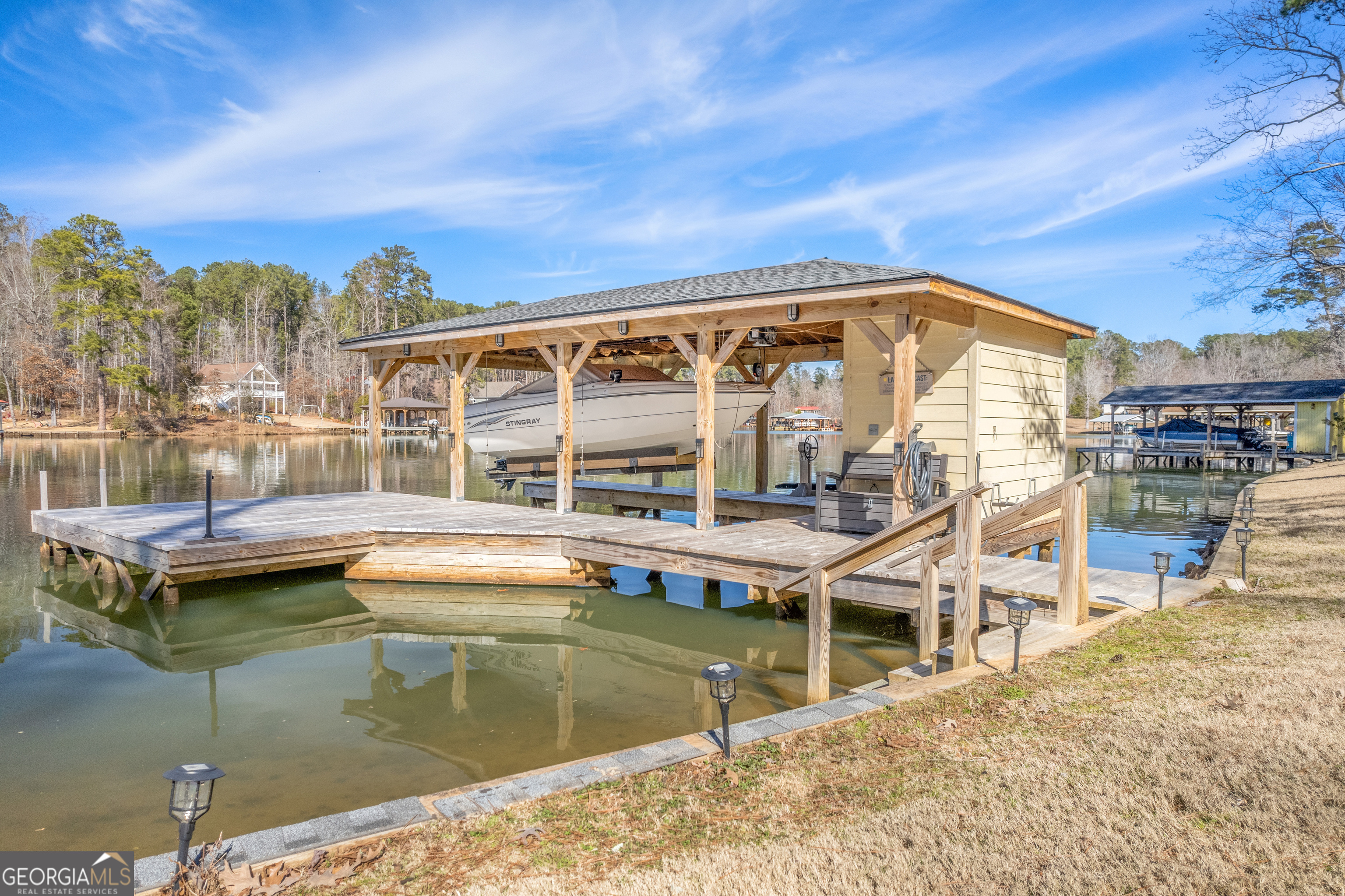 188 Sunhaven Lane Sparta, GA 31087 - Photo 13 of 63 a view of a house with pool and chairs