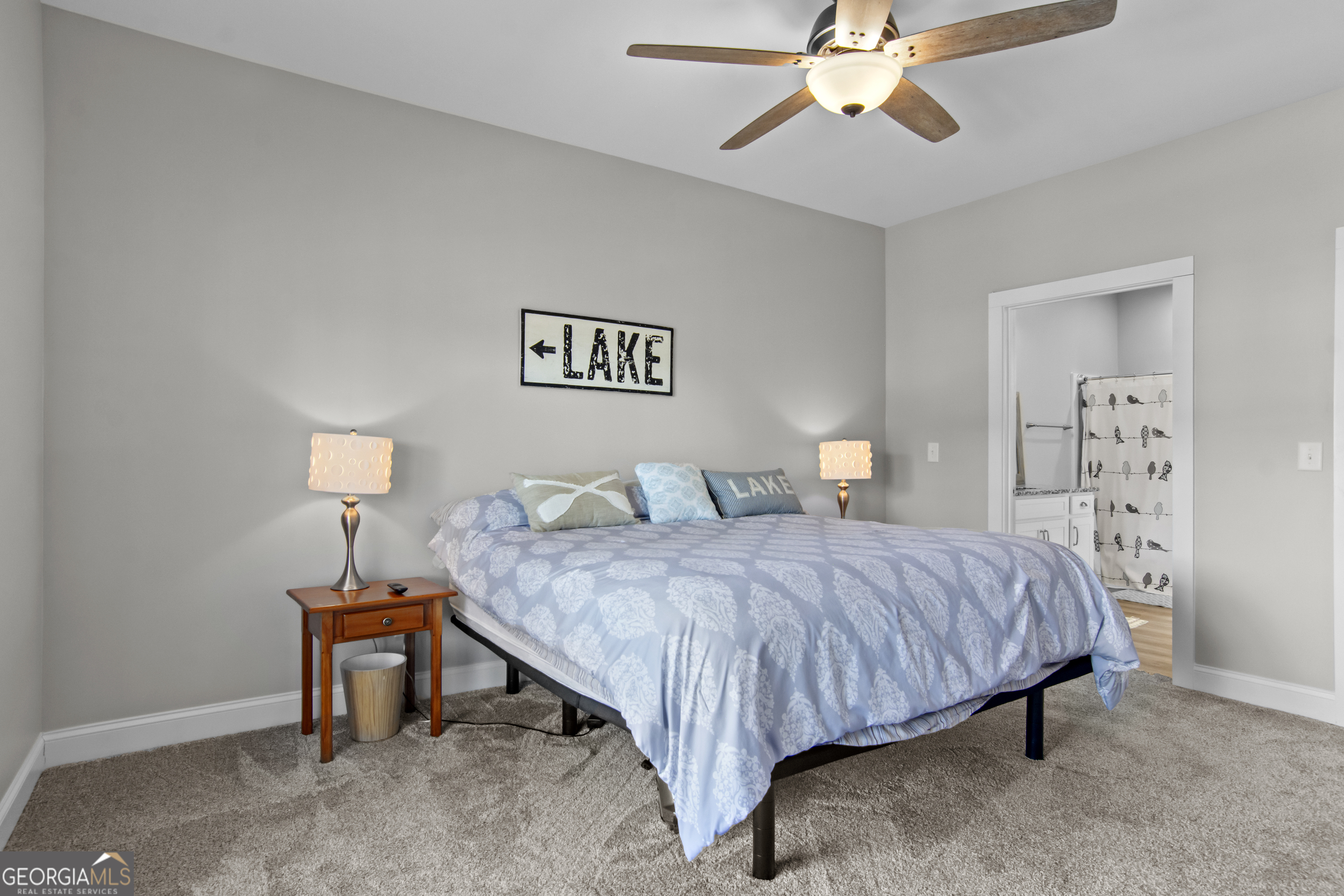 188 Sunhaven Lane Sparta, GA 31087 - Photo 32 of 63 a bedroom with a bed and a chandelier