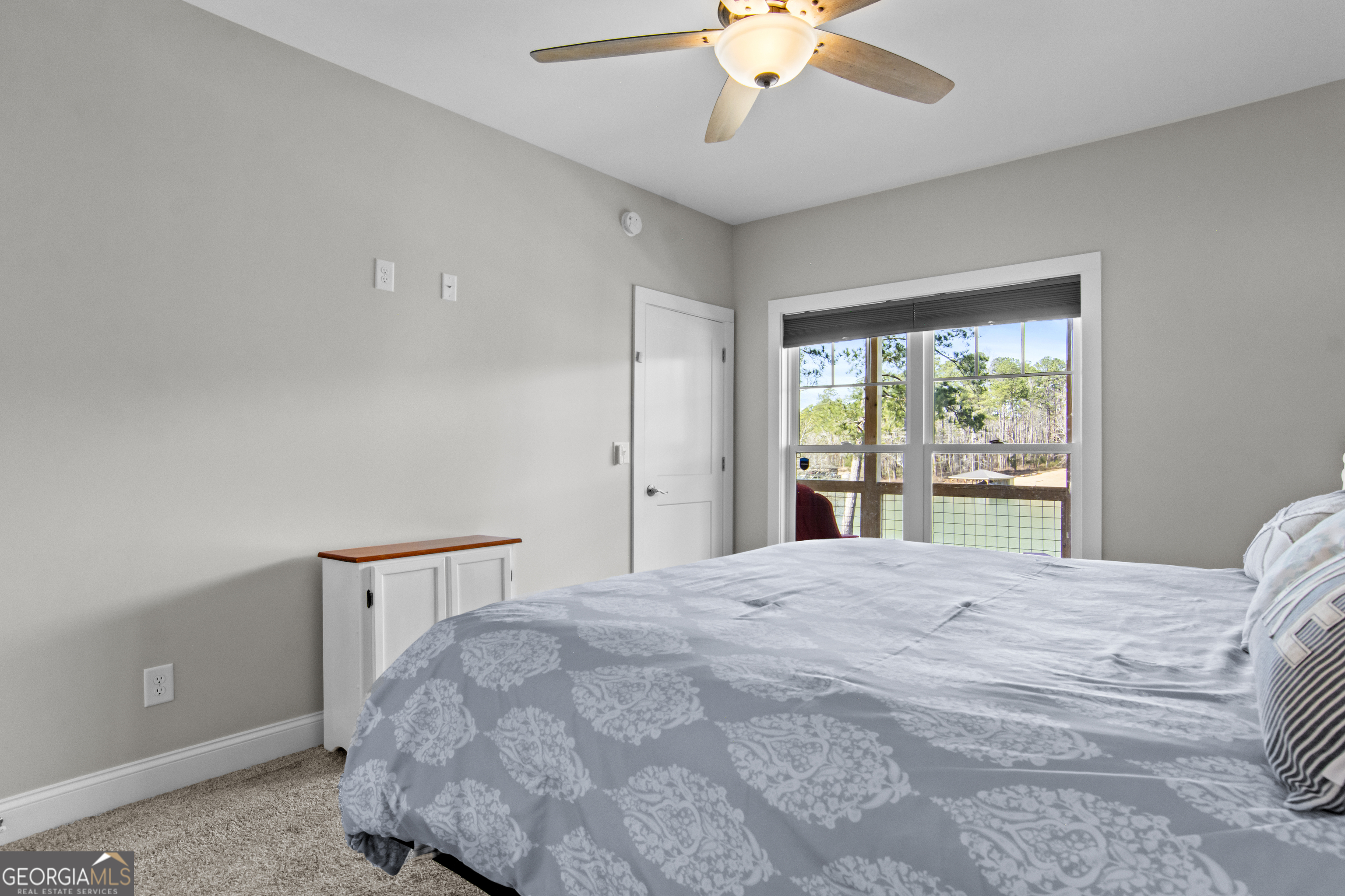 188 Sunhaven Lane Sparta, GA 31087 - Photo 35 of 63 a bedroom with a large bed and a window