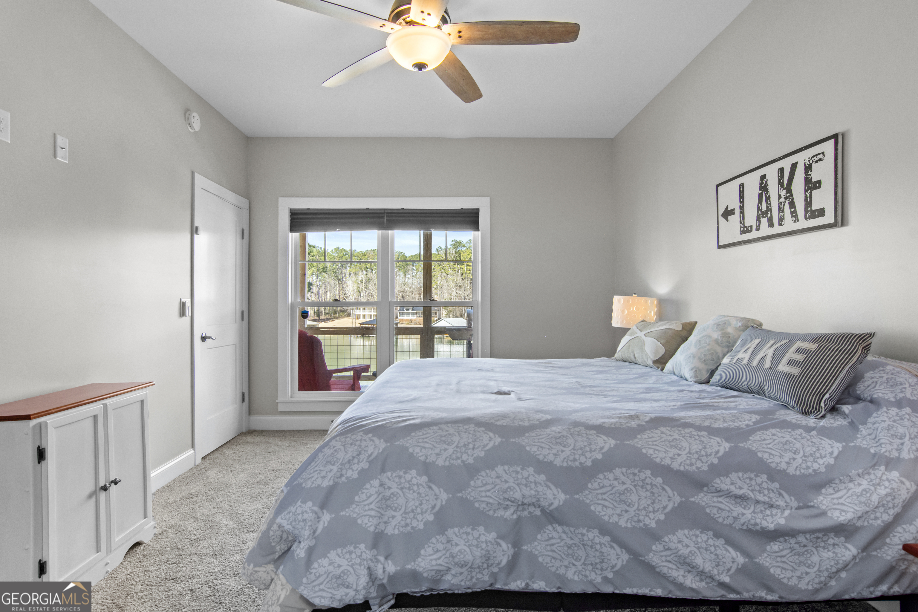 188 Sunhaven Lane Sparta, GA 31087 - Photo 36 of 63 a bedroom with a large bed and a window