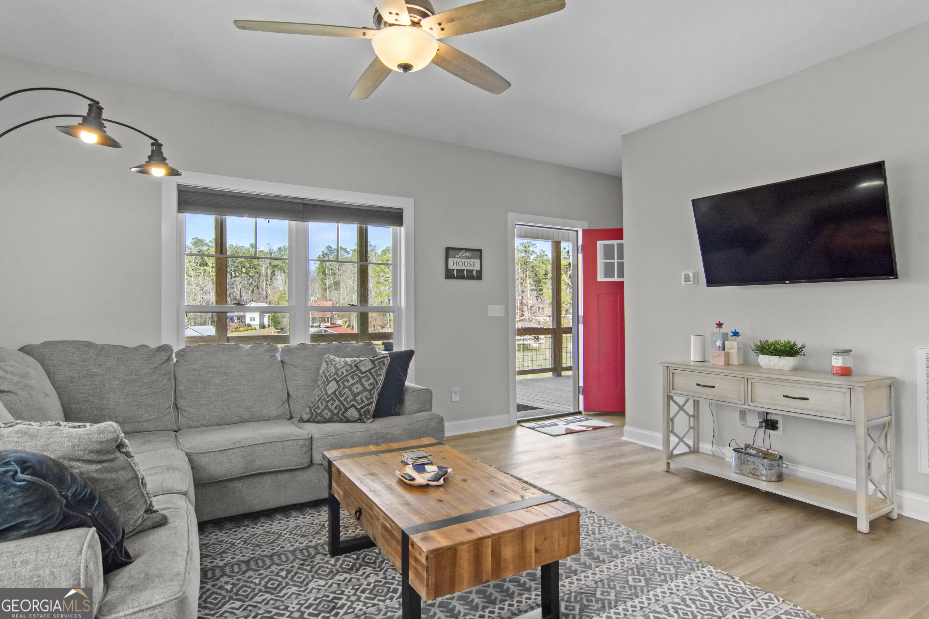 188 Sunhaven Lane Sparta, GA 31087 - Photo 37 of 63 a living room with furniture and a flat screen tv