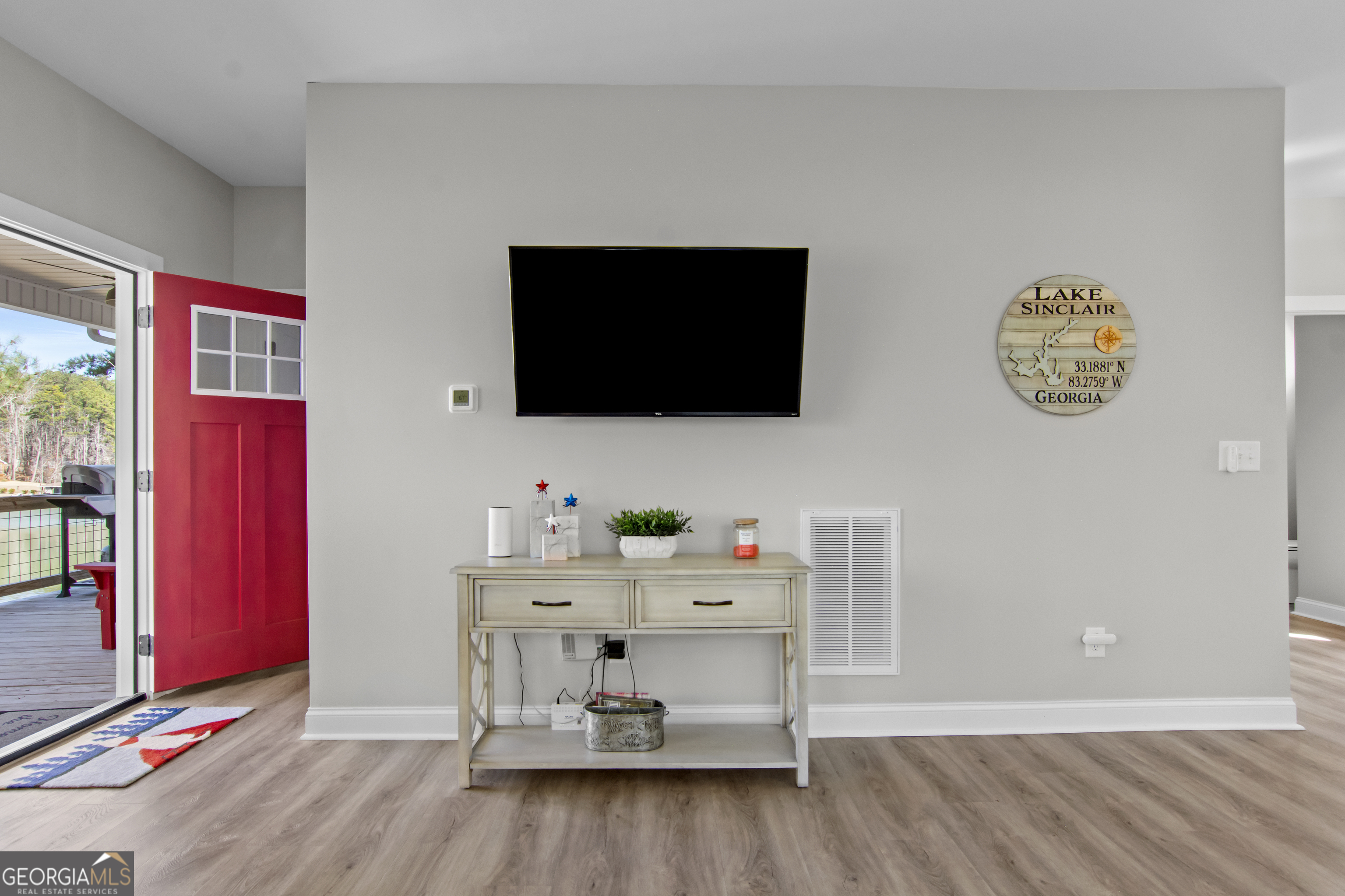 188 Sunhaven Lane Sparta, GA 31087 - Photo 39 of 63 a living room with furniture and a flat screen tv