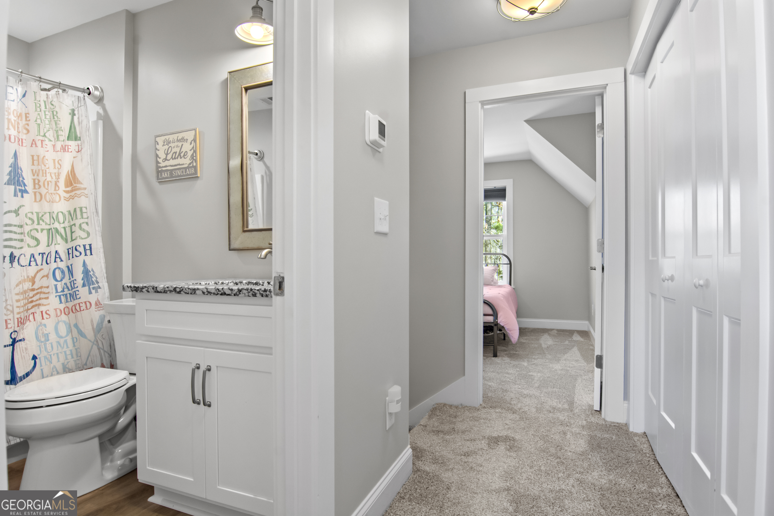 188 Sunhaven Lane Sparta, GA 31087 - Photo 43 of 63 a bathroom with a toilet sink and shower