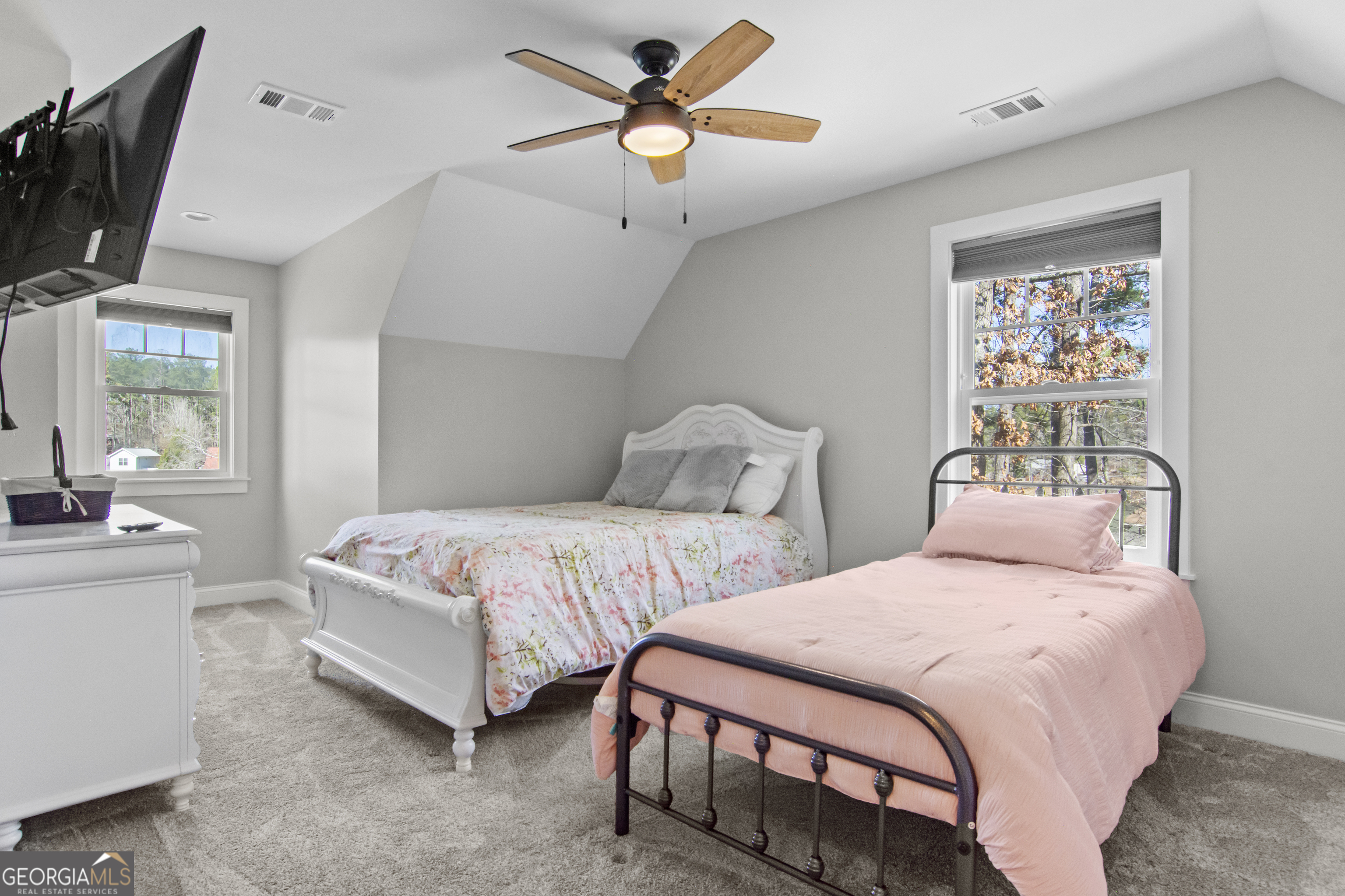 188 Sunhaven Lane Sparta, GA 31087 - Photo 44 of 63 a bedroom with two beds and a chandelier