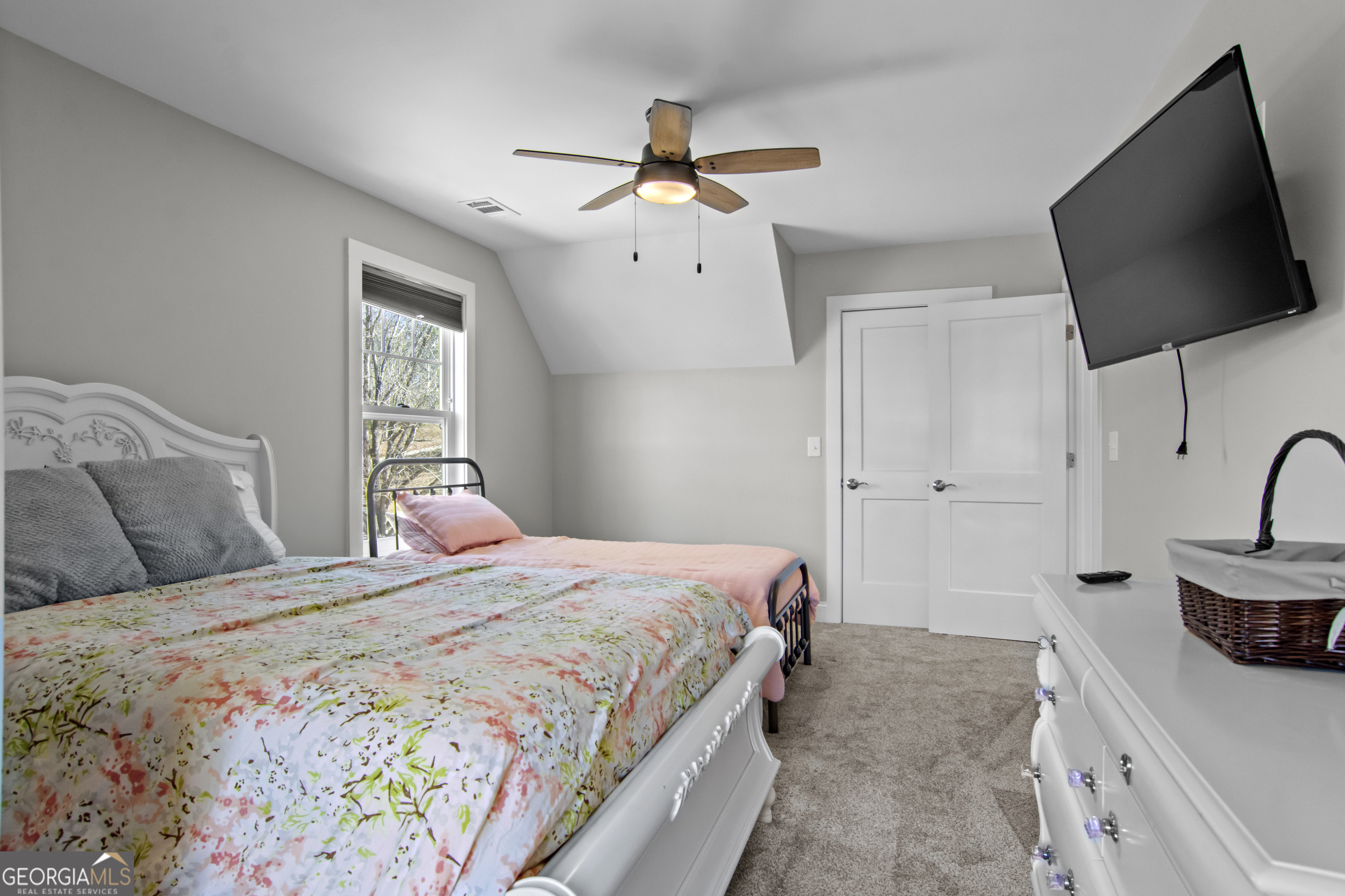 188 Sunhaven Lane Sparta, GA 31087 - Photo 45 of 63 a bedroom with a bed window and flat screen tv