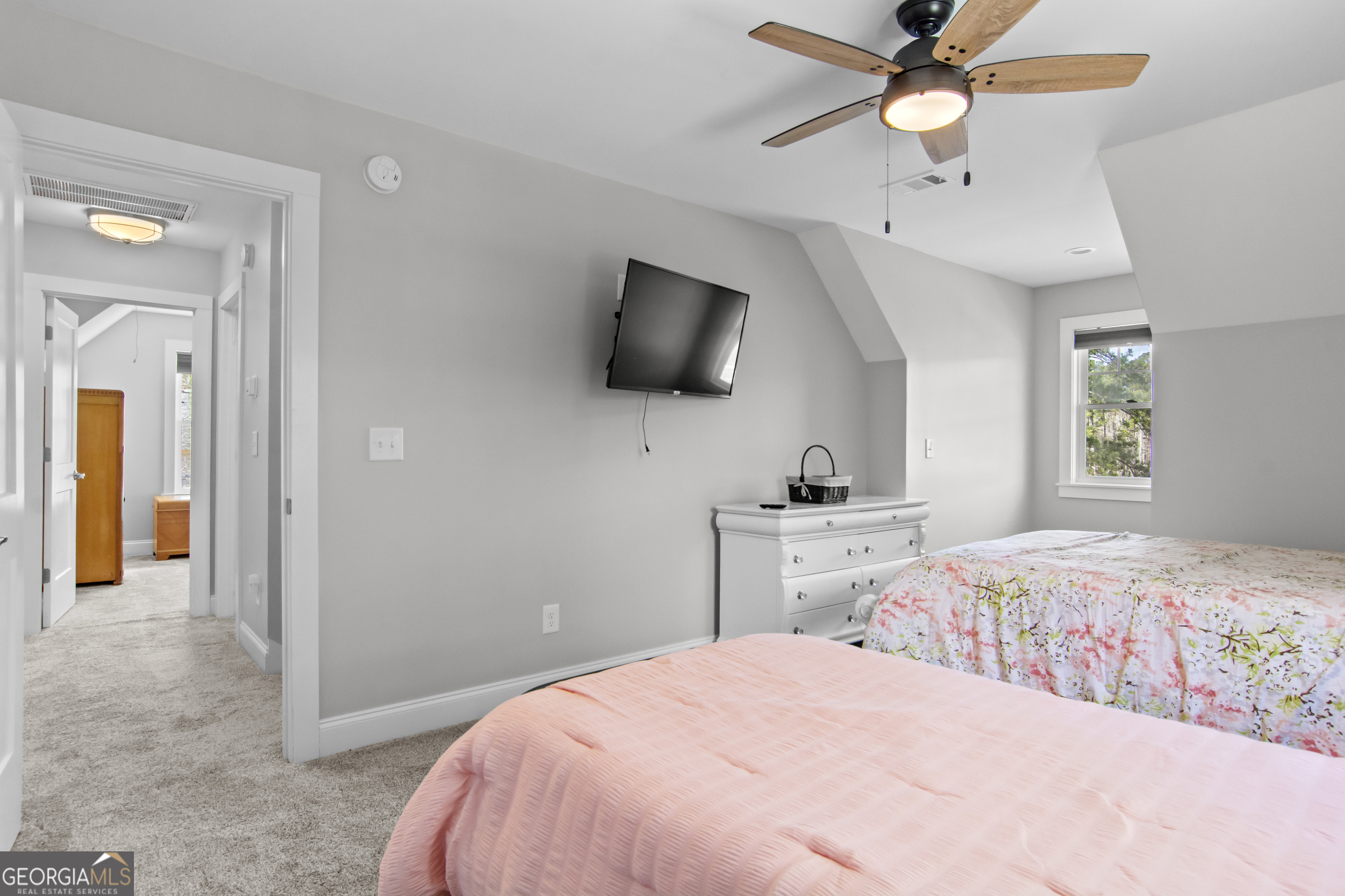 188 Sunhaven Lane Sparta, GA 31087 - Photo 46 of 63 a bedroom with a bed and a flat screen tv