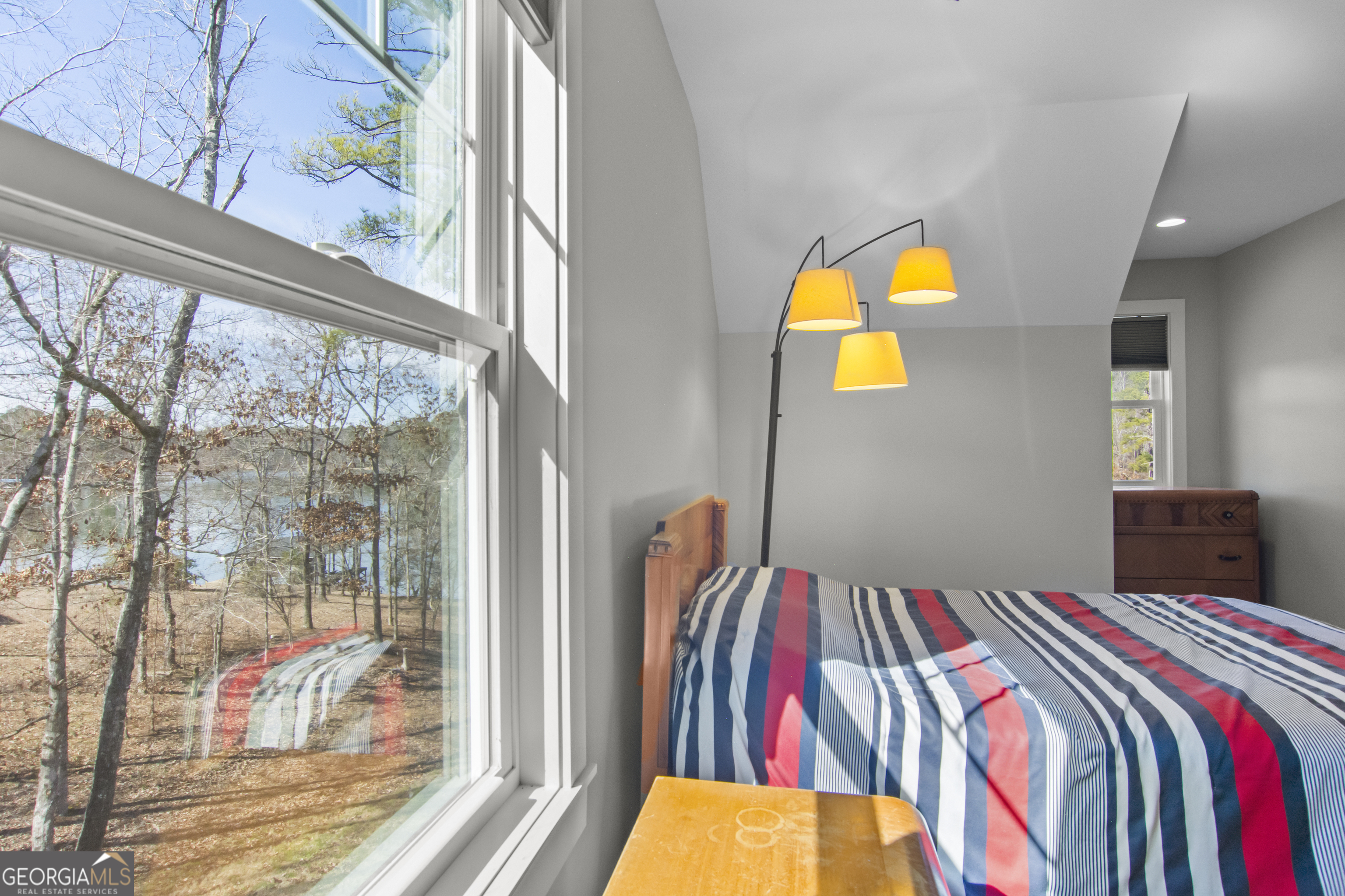 188 Sunhaven Lane Sparta, GA 31087 - Photo 50 of 63 a bedroom with a bed and a painting on the wall