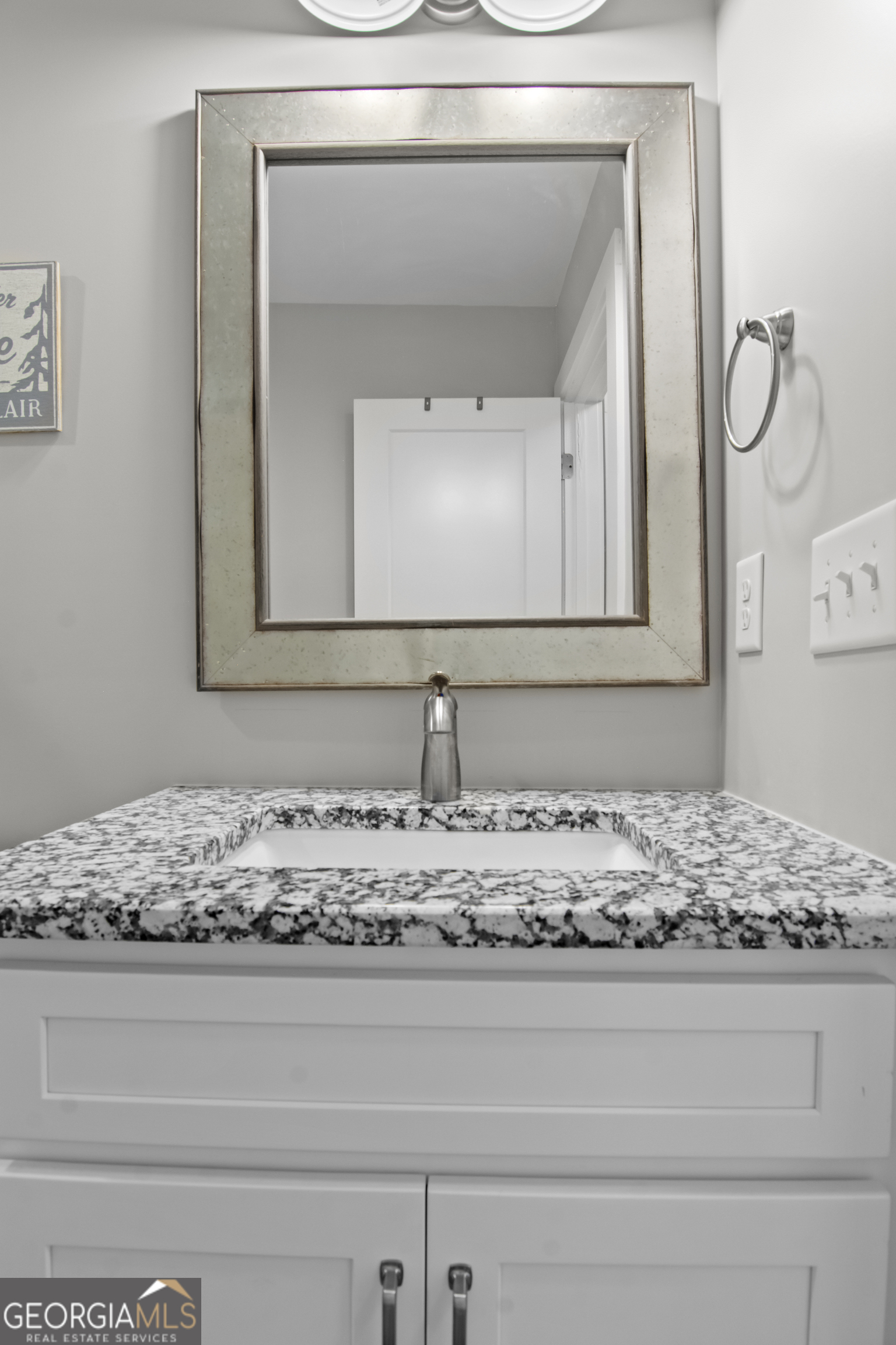 188 Sunhaven Lane Sparta, GA 31087 - Photo 53 of 63 a bathroom with a granite countertop sink and mirror