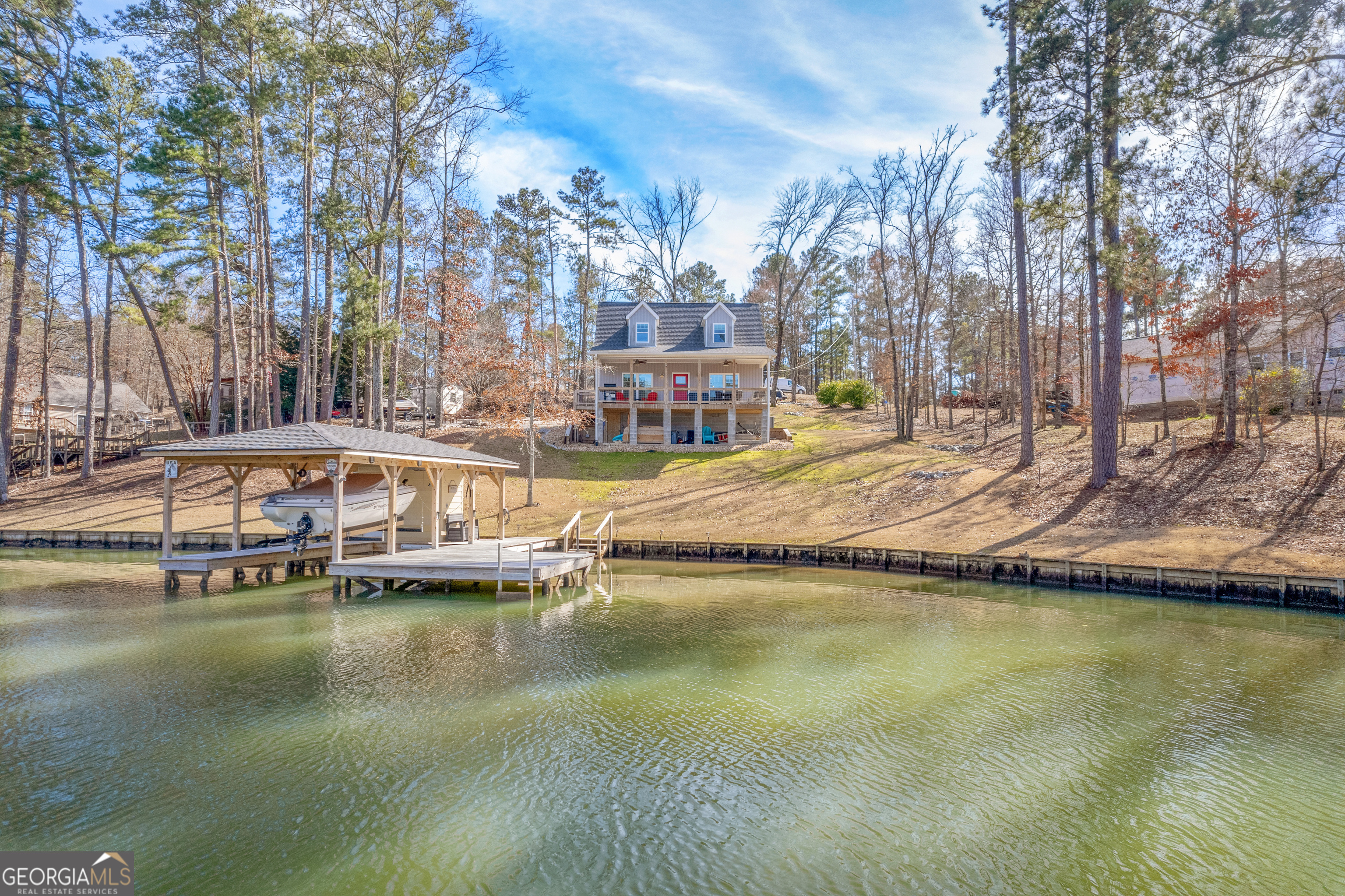 188 Sunhaven Lane Sparta, GA 31087 - Photo 9 of 63 a view of a lake with houses