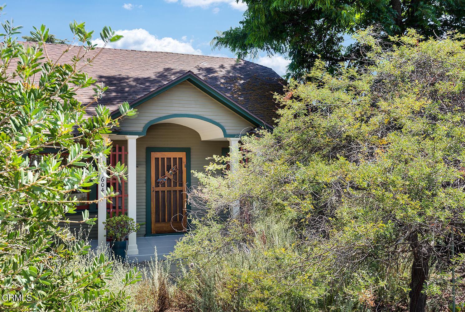 a view of a house with a small yard