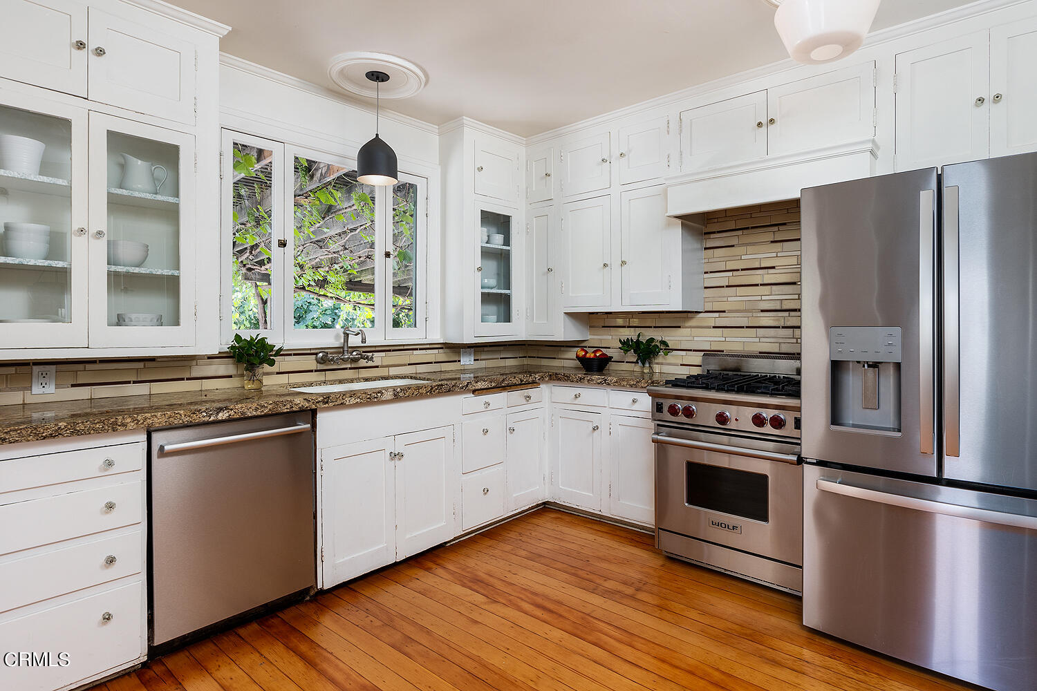 604 Douglas Street Pasadena, CA 91104 - Photo 18 of 41 a kitchen with stainless steel appliances granite countertop a sink a stove and refrigerator