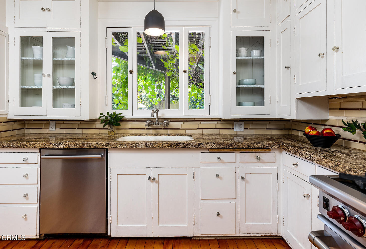 604 Douglas Street Pasadena, CA 91104 - Photo 19 of 41 a kitchen with granite countertop white cabinets and window