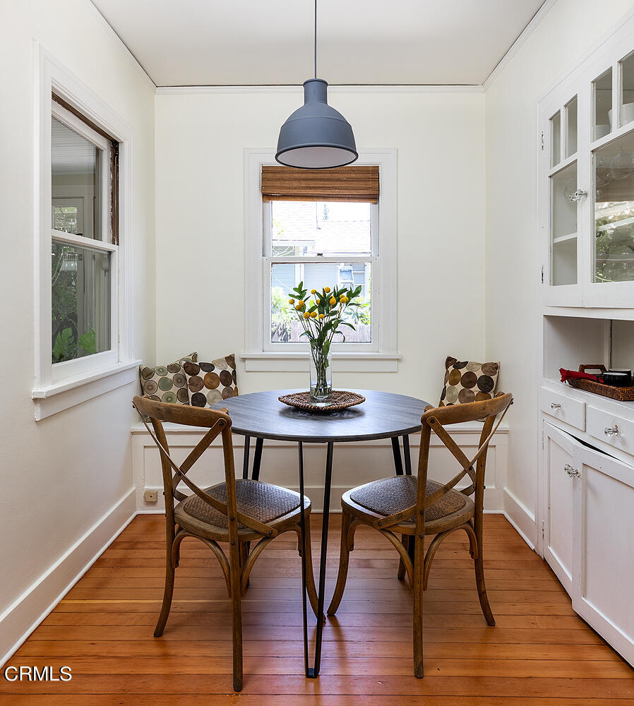 604 Douglas Street Pasadena, CA 91104 - Photo 22 of 41 a dining room with furniture and wooden floor