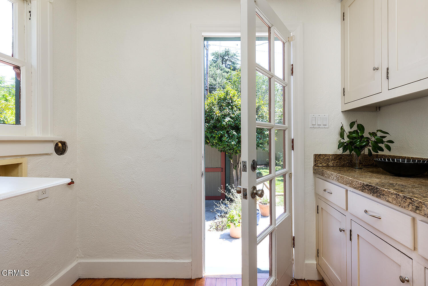 604 Douglas Street Pasadena, CA 91104 - Photo 24 of 41 a kitchen with stainless steel appliances granite countertop a refrigerator and a white cabinets