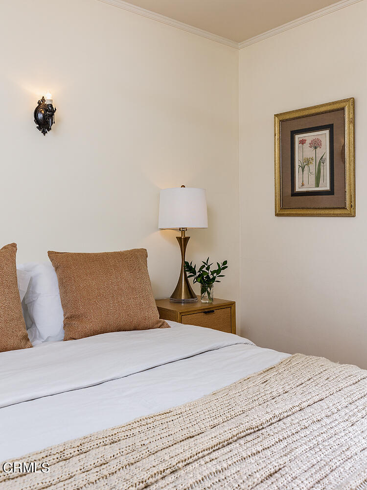 604 Douglas Street Pasadena, CA 91104 - Photo 31 of 41 a bedroom with a bed and a painting on the wall