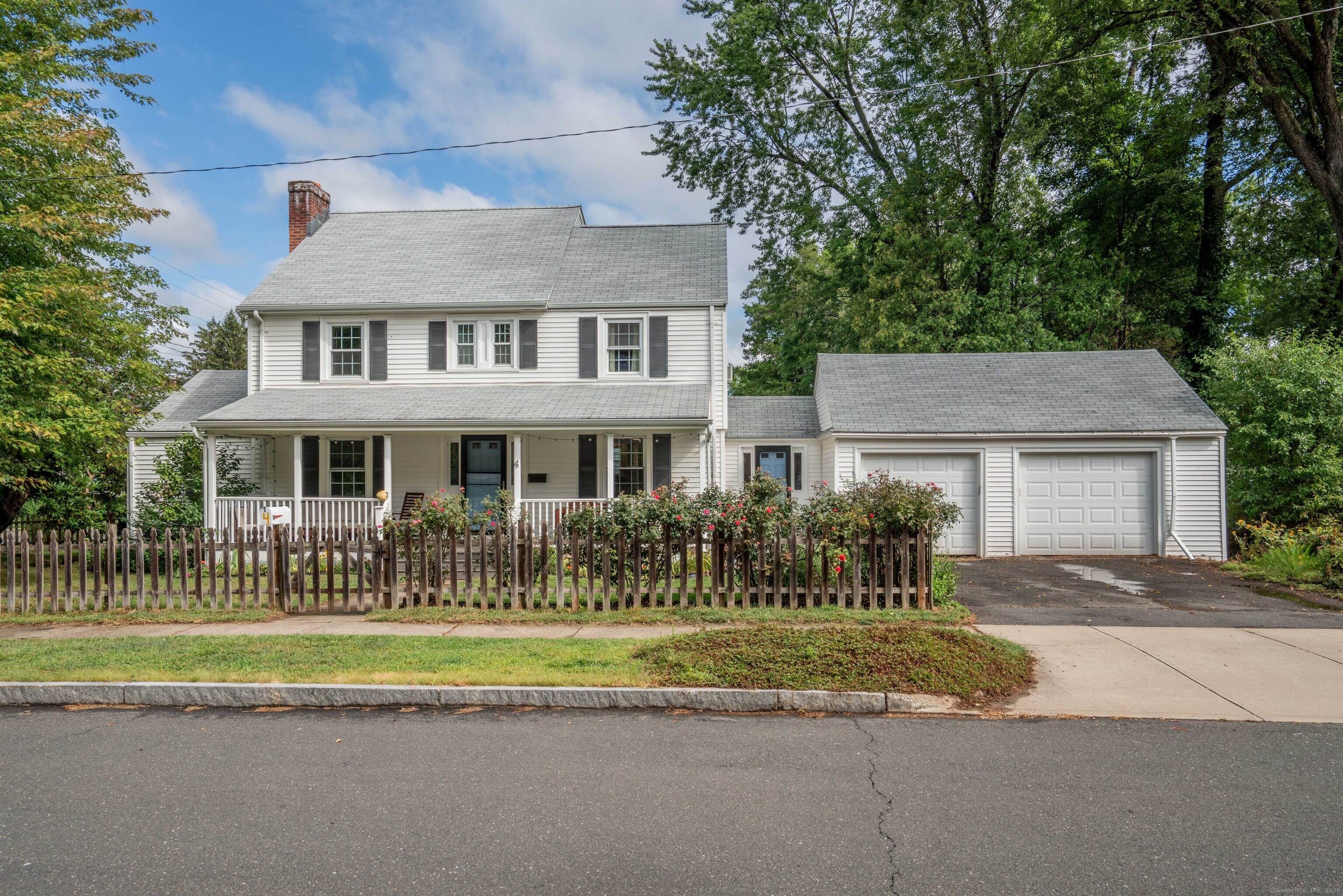4 Frederick Road West Hartford, CT 06119 - Photo 1 of 1 a front view of a house with a garden