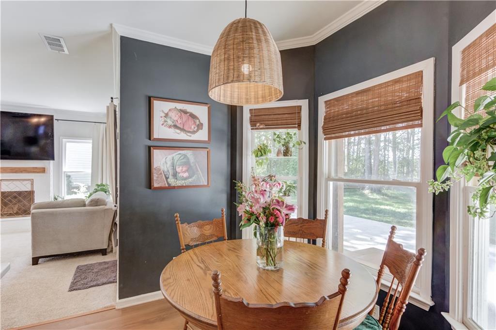 2310 Olde Hickory Place Monroe, GA 30656 - Photo 14 of 46 a view of a dining room with furniture window and wooden floor