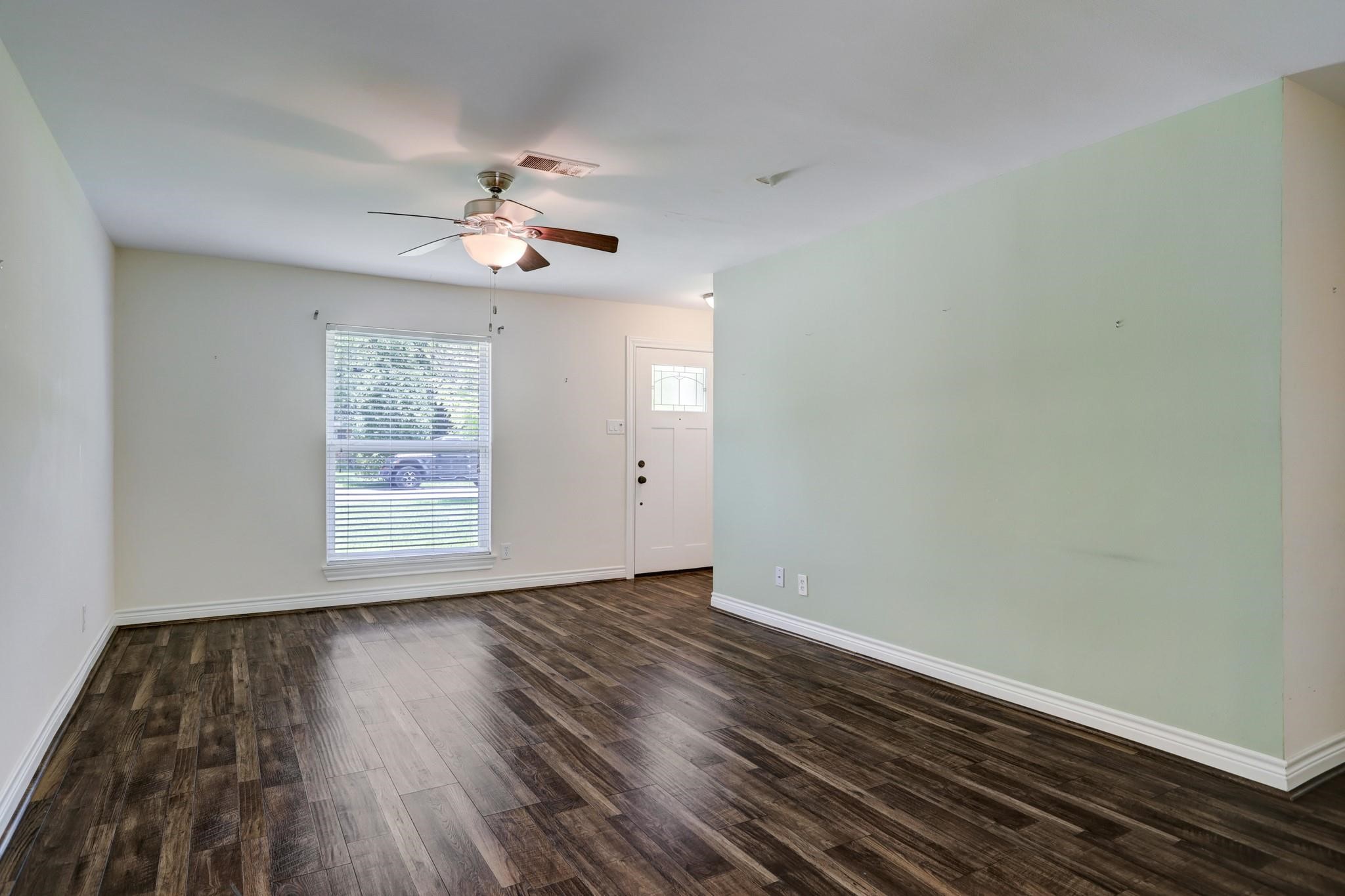 9410 Pipestone Street Houston, TX 77074 - Photo 10 of 10 wooden floor in an empty room with a window