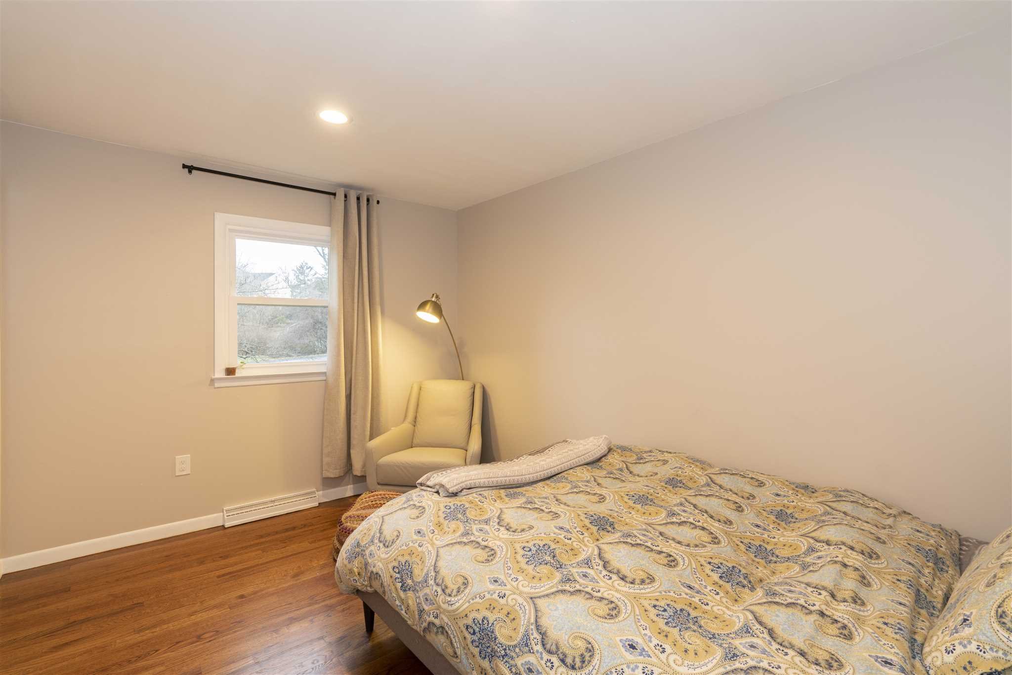 13 Slate Hill Drive Poughkeepsie, NY 12603 - Photo 15 of 30 a bedroom with a bed and wooden floor