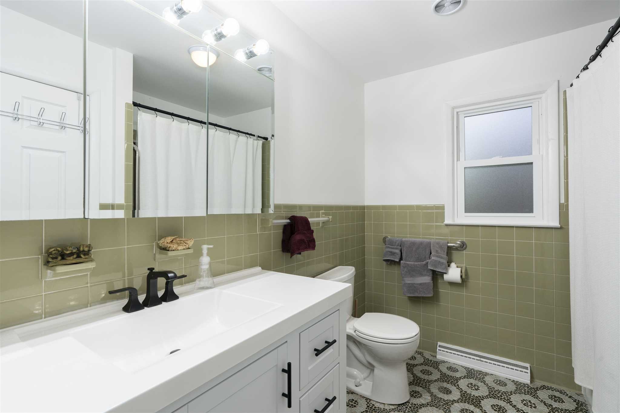 13 Slate Hill Drive Poughkeepsie, NY 12603 - Photo 16 of 30 a bathroom with a sink a toilet and mirror