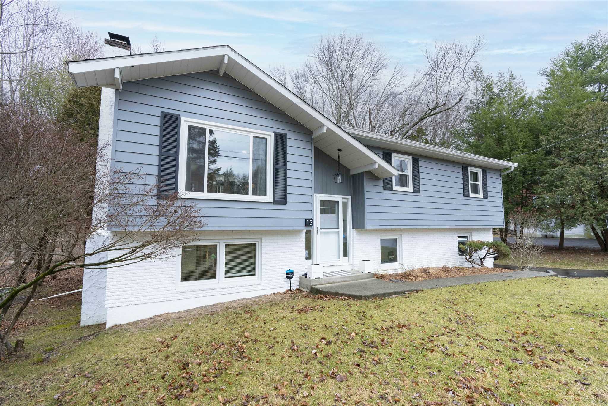 13 Slate Hill Drive Poughkeepsie, NY 12603 - Photo 2 of 30 a front view of a house with a yard