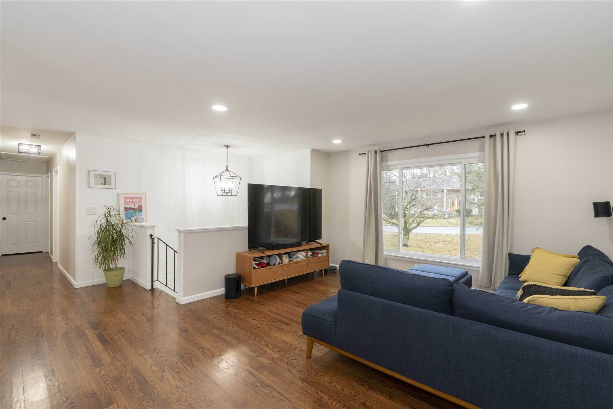 13 Slate Hill Drive Poughkeepsie, NY 12603 - Photo 3 of 30 a living room with furniture and a flat screen tv